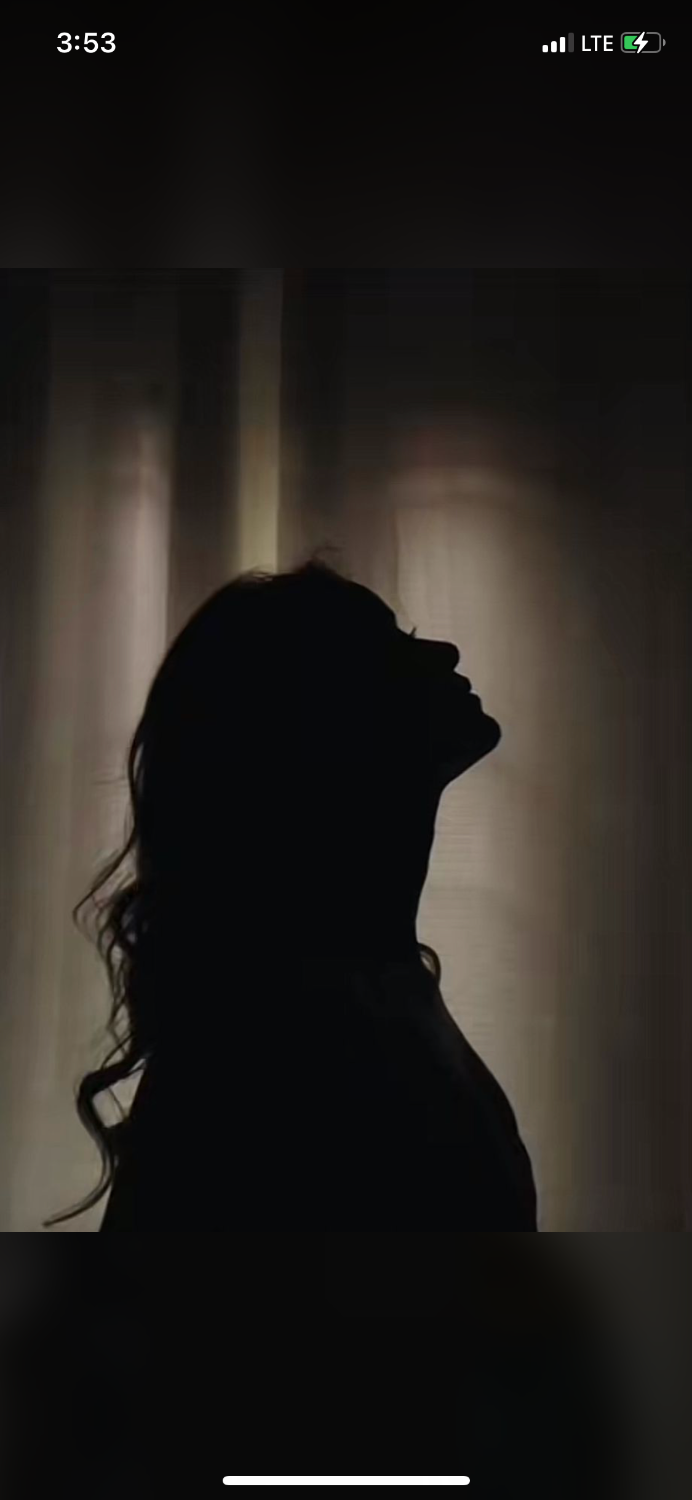 Silhouette of a Woman in Peaceful Reflection