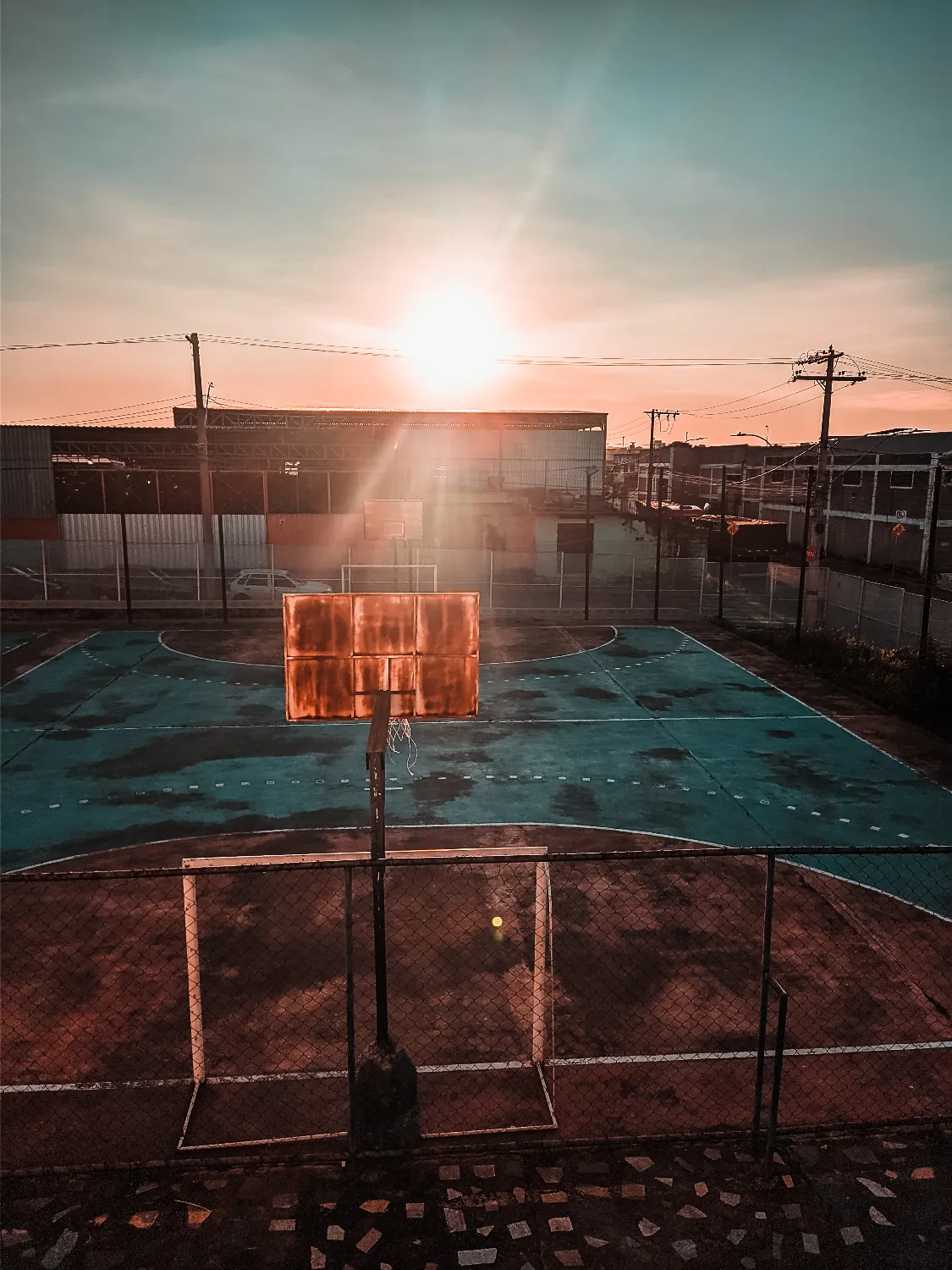 Urban Basketball Court at Sunset
